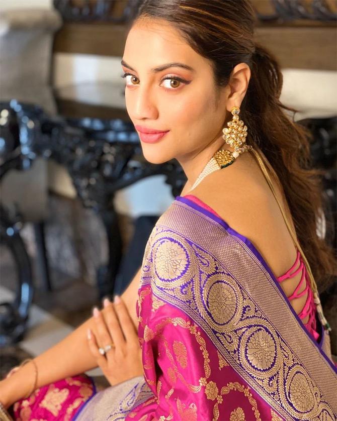Bengali actress and MP Nusrat Jahan on Thursday took to Instagram and shared a series of photos of herself in ethnic wear. Nusrat, who donned a pink Kanjeevaram saree with a purple zari border looked simply elegant in the nine-yard traditional wear.