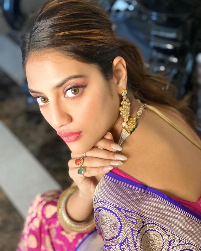 In photo: Nusrat Jahan looks fearless in a pink Kanjeevaram saree while posing for the lenses