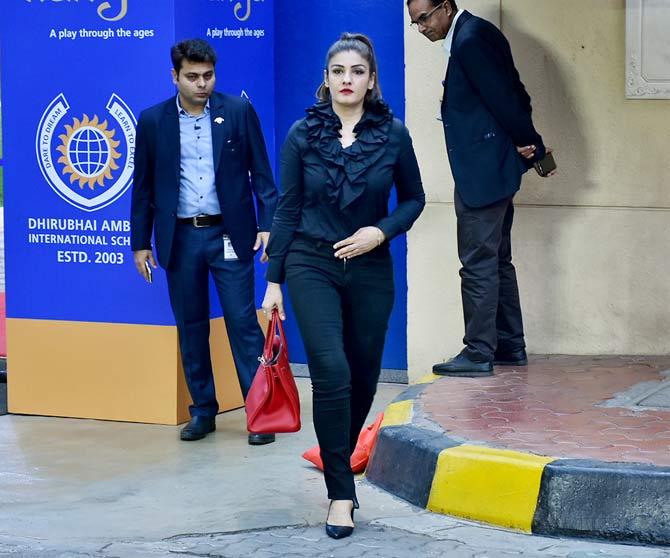Raveena Tandon opted for a black ruffled shirt, paired with black trouser pants and pumps to attend the event.