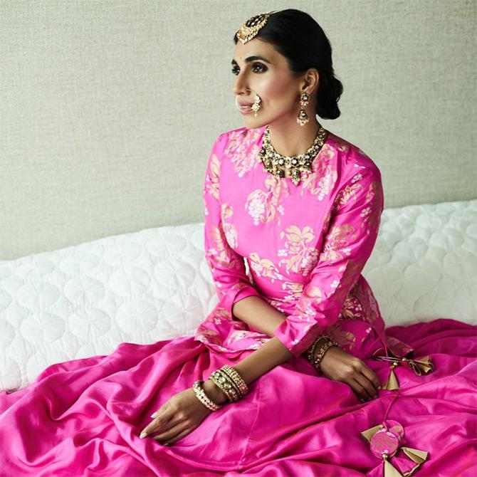 Prerna channels her inner bride in this bright pink silk lehenga replete with a nosering and a maangtika