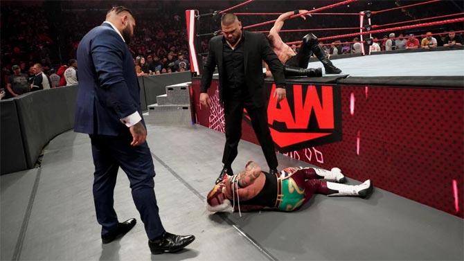 Akam and Rezar launched another attack on Rey Mysterio and then dragged him towards the entrance where Seth Rollins Curb Stomped him once again