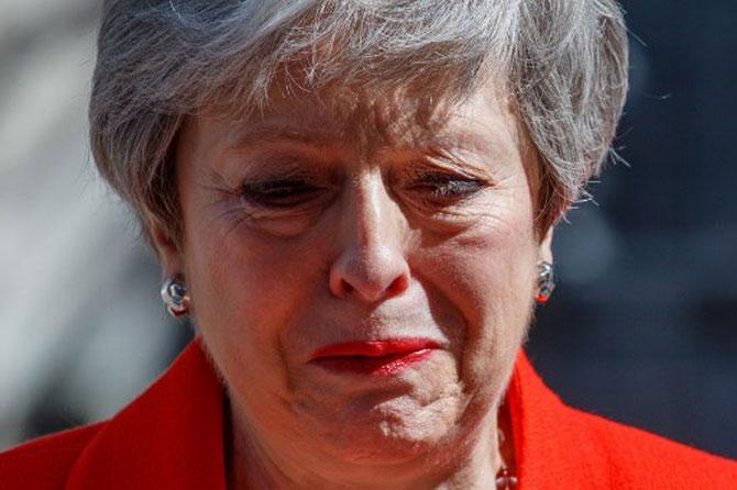 Britain's Prime Minister Theresa May reacts as she announces her resignation outside 10 Downing street in central London on May 24, 2019. Beleaguered British Prime Minister Theresa May announced on Friday that she will resign on June 7, 2019, following a Conservative Party mutiny over her remaining in power.