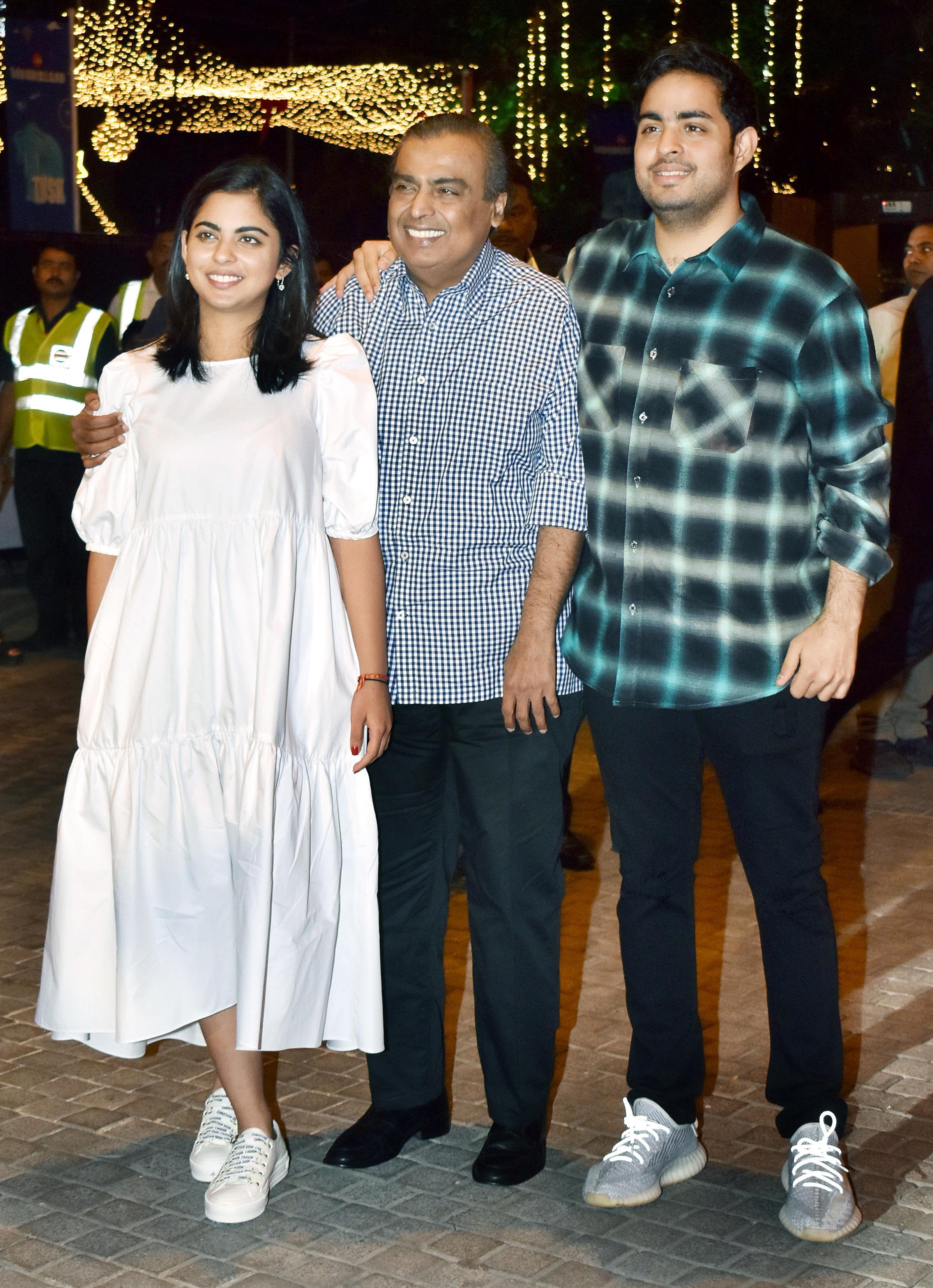 Business tycoon Mukesh Ambani was snapped by the paparazzi alongside his daughter Isha and son Akash at the red carpet premiere night of JioWonderland held at Jio World Garden in BKC