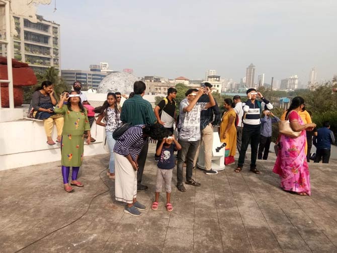 To witness the rare sight of the solar eclipse, students and families visited Nehru Planetarium in Worli. Nehru Planetarium is an entertainment and learning centre featuring shows about space in a domed theatre stargazing events.
Picture courtesy: Ashish Raje