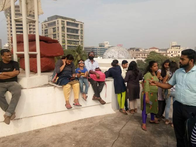 The viewers used special-purpose 'eclipse glasses' to view the eclipse as experts said people should not look directly at the Sun during the solar eclipse without solar filters, pinhole camera or a telescopic projection.