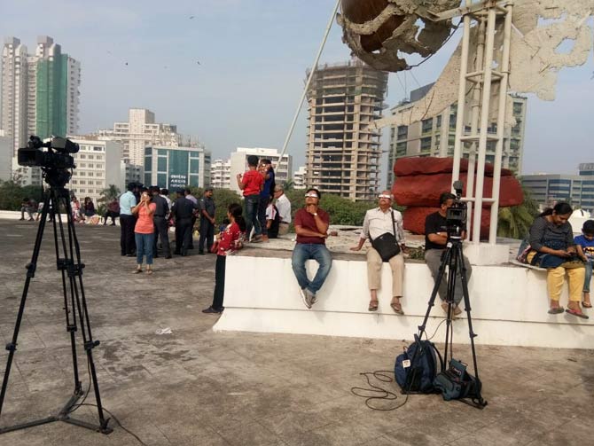 Few reporters and cameramen too had gathered to capture the partial solar eclipse.