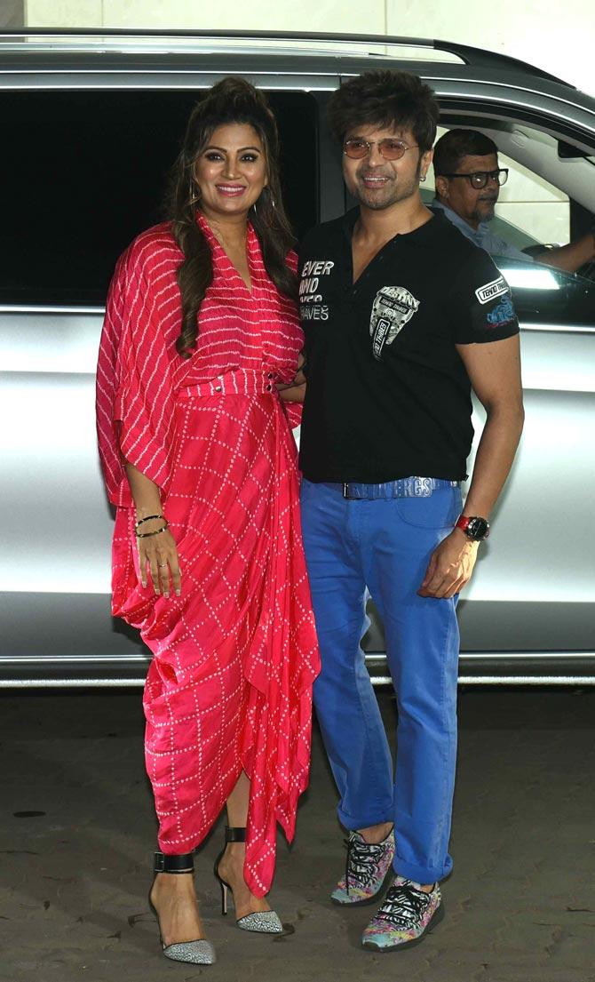 Himesh Reshammiya and wife Sonia arrive for Salman Khan's birthday party at Sohail Khan's residence in Bandra.