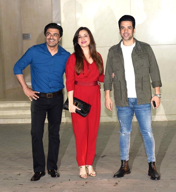 Samir Soni with Neelam and Tusshar Kapoor posed for the photographers at Salman Khan's birthday party.