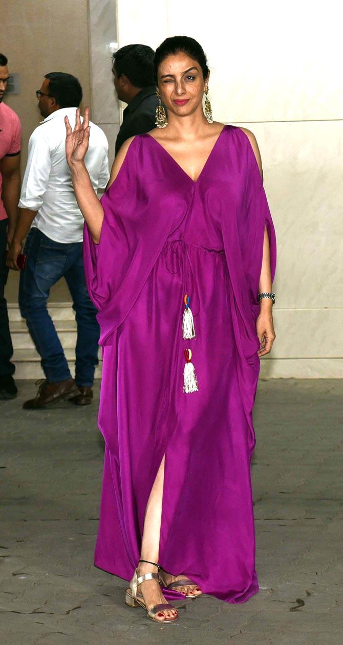 Tabu had fun posing for the photographers as she arrived for Salman Khan's birthday party. Tabu looked pretty in her purple Kaftan dress.