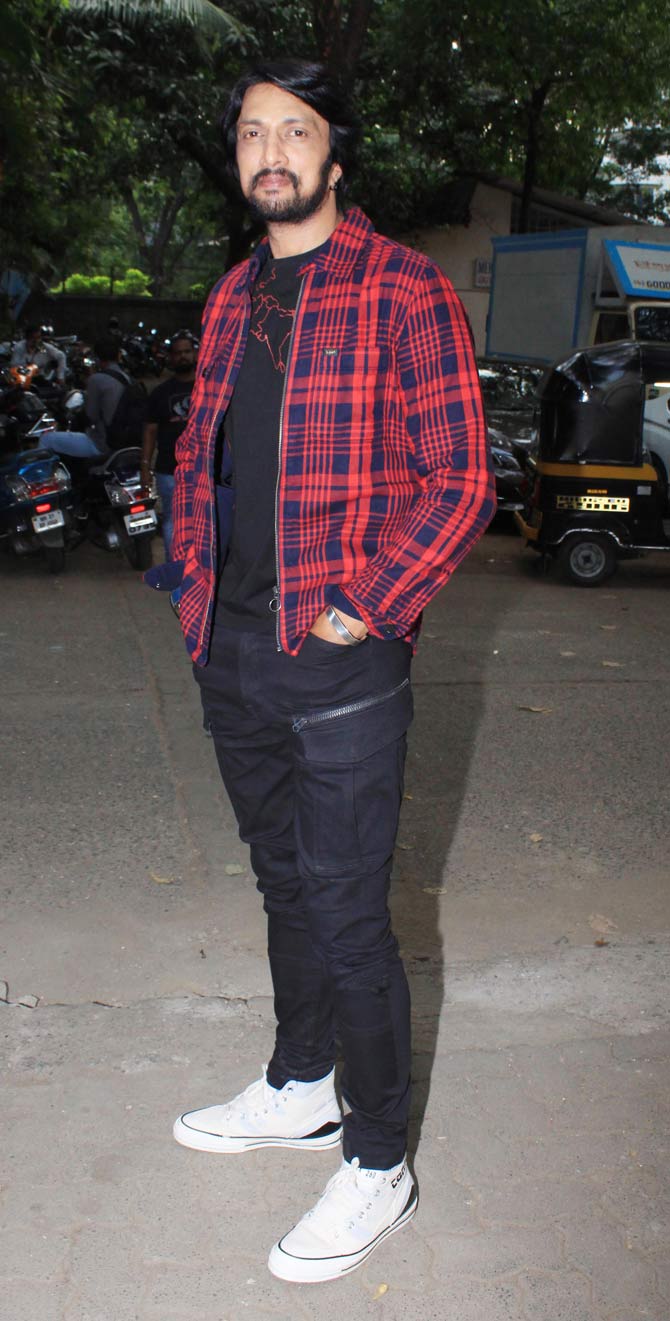 Kichcha Sudeepa, who will portray Balli the antagonist, was also seen promoting Dabangg 3 in Bandra, Mumbai. The actor was casual in a pair of black jeans, a black t-shirt and a red checked shirt.