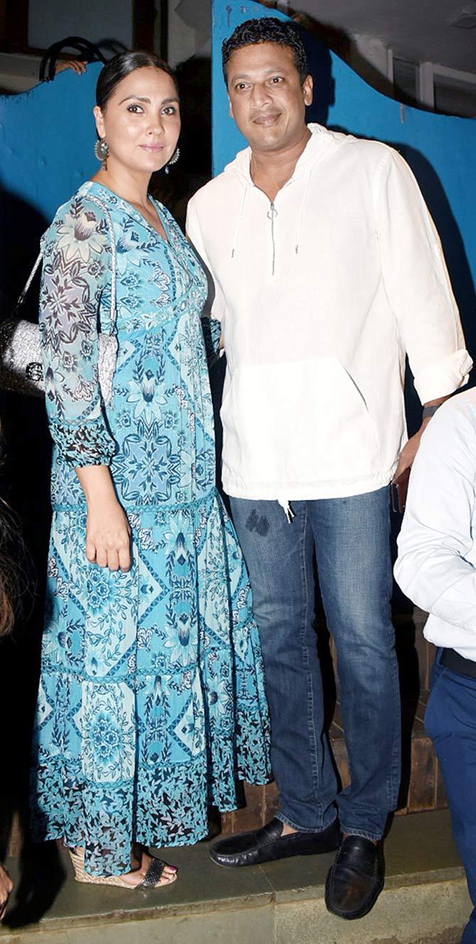 Lara Dutta and husband Mahesh Bhupati were all smiles as they posed for the photographers at Raza Beig's birthday party in Bandra.