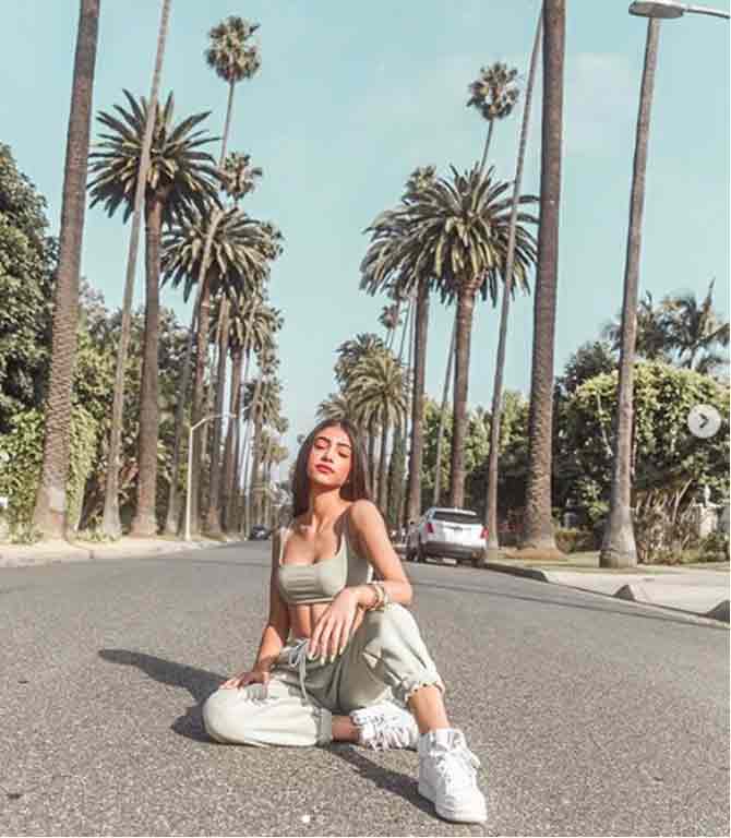 Amidst the backdrop of the famous trees of Beverly Hills in California, Panday looks splendid in a grey crop top and white sneakers.