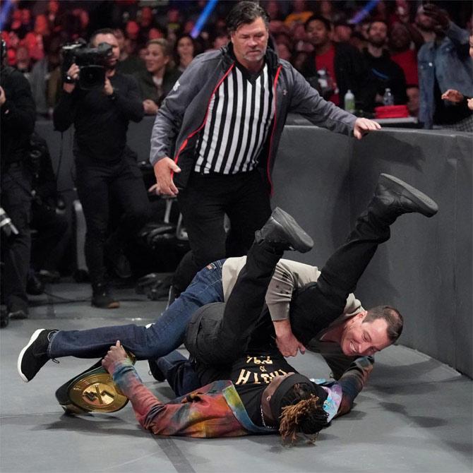 After Andrade's win, R-Truth was seen trying to escape with his 24/7 title, but was greeted and then shockingly defeated by NASCAR champion Kyle Busch to be the new 24/7 title holder