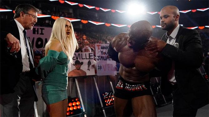 However, after Lashley checked a security officer, who happened to be a Rusev fan, he was arrested. After Lana slapped the officer, she was put in handcuffs as well as the couple were taken out of the arena