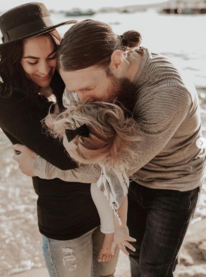 WWE Total Divas star Brie Bella posted this photo with husband Daniel Bryan and their daughter with a strong message. She said, 'As Bryan heads back on the road we realized how much our family needed to escape to the Mountains and Lake. Away from chaos and surrounded by peaceful sounds of nature our hearts remember what’s important. Family, love, nature and the simple things that come for free. We promise to protect you Mother Earth, thank you for constantly making us feel fulfilled. #love #savetheplanet #family #adventures #lakevibes #mountains @emmawynnpaul'