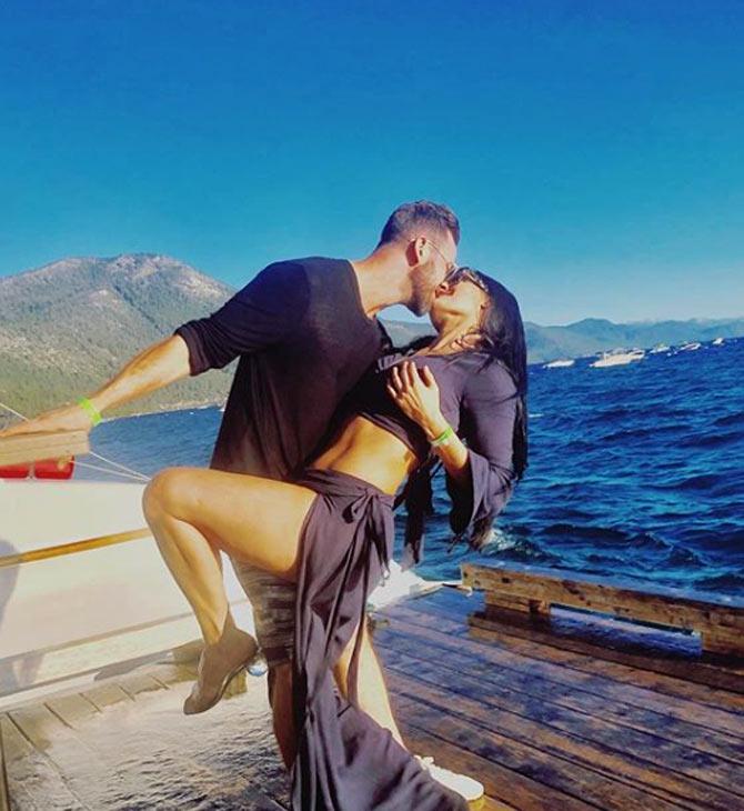WWE Total Diva star Nikki Bella posted this romantic candid photo with her dancer boyfriend Artem during a holiday in Lake Tahoe. She wrote, 'ake Tahoe makes my soul smile & my inner child come out and play!'