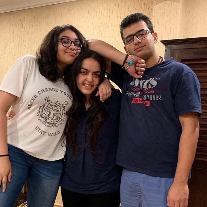 Smriti Irani's children in a quirky pose, as Zohr Irani flaunts his bracelet while Zoish hugs her sister, Shanelle Irani.