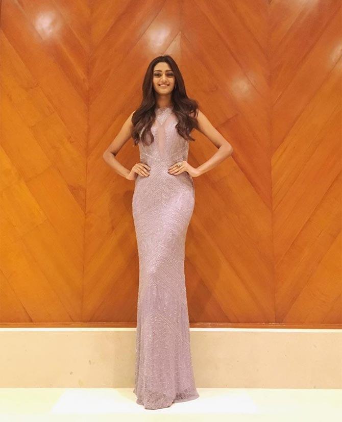 From the beginning, this achieving woman knew she wanted to be a model and participate in the pageant. She once again stuns in this baby pink, body-hugging gown and says, 