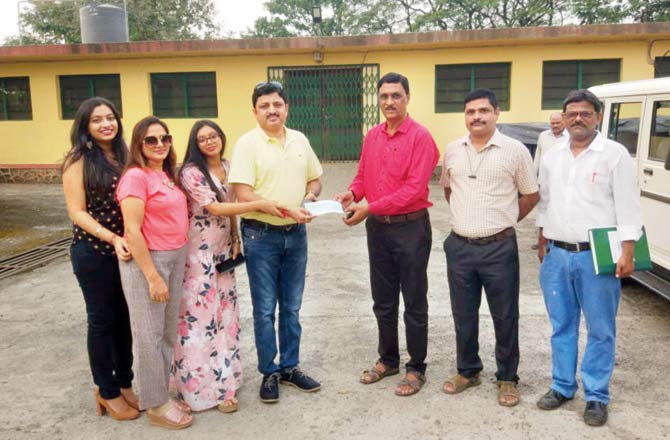IAS Milind Borikar with his family and SGNP officials