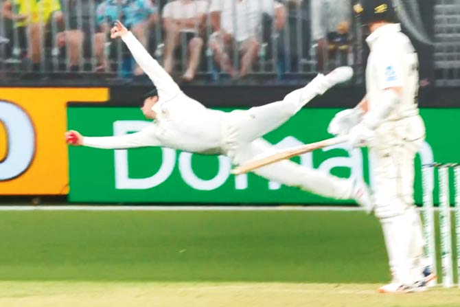 The above screengrab shows Smith taking a stunning one-handed diving catch at second slip to dismiss New Zealand’s Kane Williamson