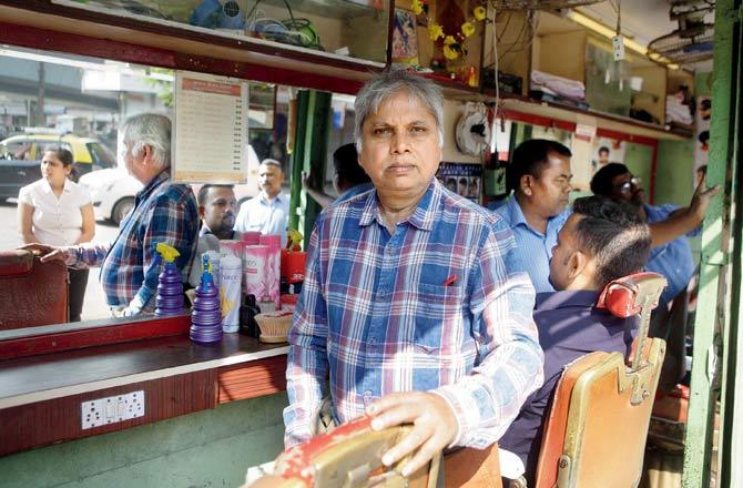 Suresh Kumar and his daughter Preeti at Kumar’s Hairdresser, the first barber shop he opened in the 1970s. The family has added three salons for men and women on parallel Ambedkar Road 