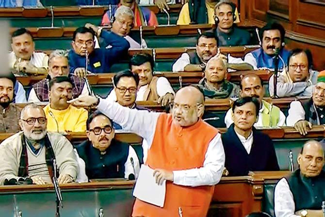 Union Home Minister Amit Shah speaks in the Lok Sabha during the ongoing winter session of Parliament, in New Delhi. PIC/PTI