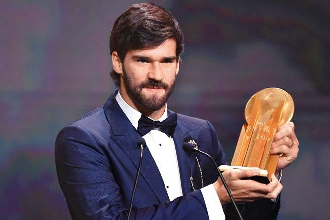 Liverpool’s Alisson Becker (left) clinches the Yashin Trophy for the best goalkeeper