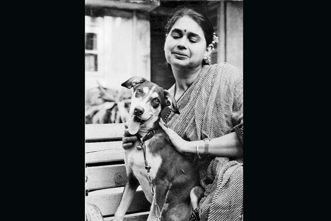 Welfare of Stray Dogs founder Abodh Aras' mother Alekha with a maali's dog in the garden of Dhun Lodge, the 1906-built Tardeo building demolished on Christmas Day, 2014. The Aras family lived next door in Dharma Nivas, earlier Tukaram Building.  The son of pioneer printer Javji Dadaji, Tukaram first constructed Dhun Lodge as Javji Building