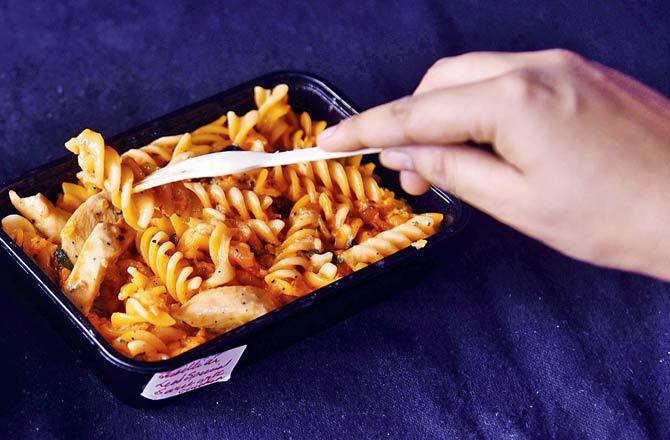 The food comes neatly packed in plastic containers with stickers of quirky Mumbai-themed artwork