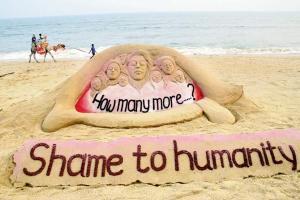 A sand sculpture by artist Sudarsan Pattnaik in memory of P Priyanka Reddy draws attention to the spate of crimes against women. Pic/PTI