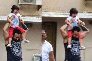 Taimur bursts out crying as he takes a ride on dad Saif's shoulders