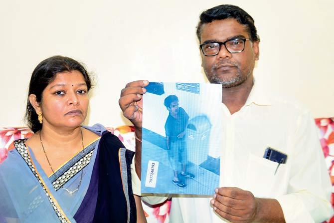 Tarun’s parents Vinod and Asha Gupta with a CCTV grab  showing Tarun. FILE PIC
