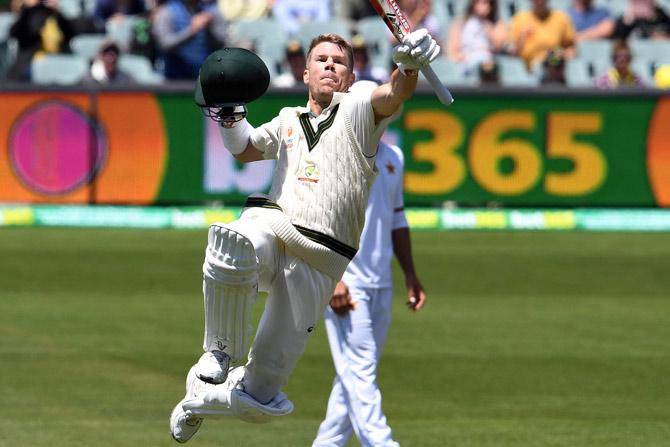 David Warner celebrates reaching double century (200 runs) on day two of the second cricket Test match between Australia and Pakistan