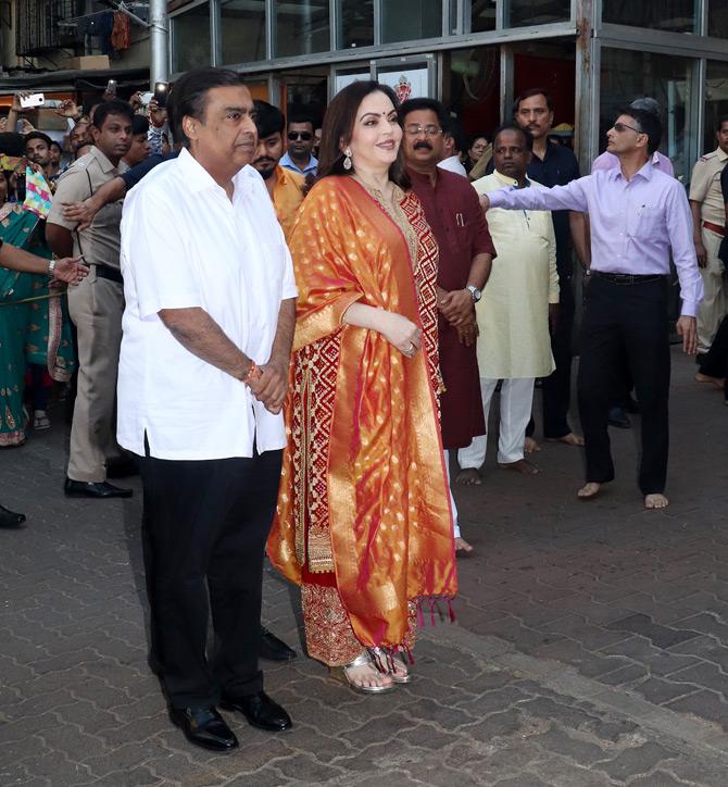 Mukesh Ambani, Nita Ambani, and Anant Ambani were welcomed by Siddhivinayak temple's chairman Aadesh Bandekar as the trio offered the first wedding card of Akash and Shloka. The couple is reportedly set to tie the knot on March 9, 2019