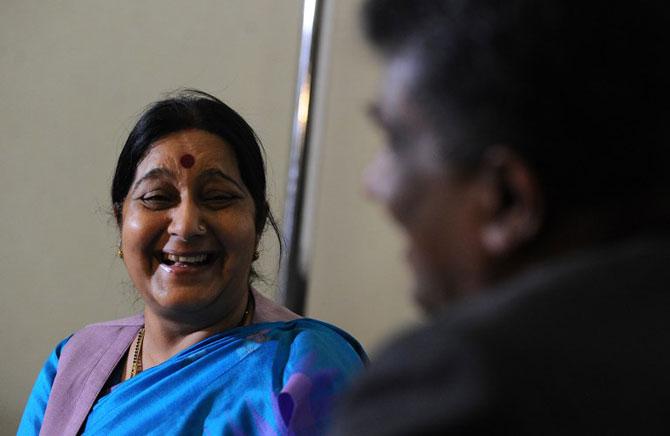 Sushma Swaraj smiles after arriving at the Bandaranaike International Airport in Katunayake on March 6, 2015.