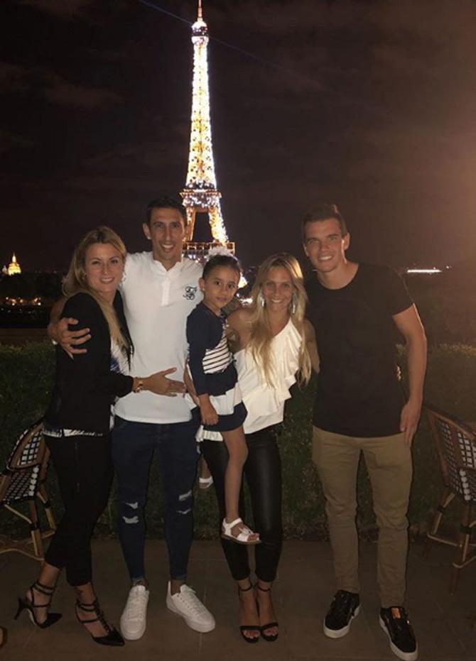 During his younger playing days, Angel Di Maria also helped his parents with their work at a local coal yard 
In pic: Angel Di Maria posted this picture of himself and friends in front of the Eiffel Tower, He wrote, 