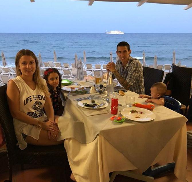 Angel Di Maria has also got an Italian passport due to his Italian ancestry, and is nicknamed 'Noodle' due to his slender frame. 
In pic: Angel Di Maria posted this picture of a sea-side lunch outing with his wife and kids.