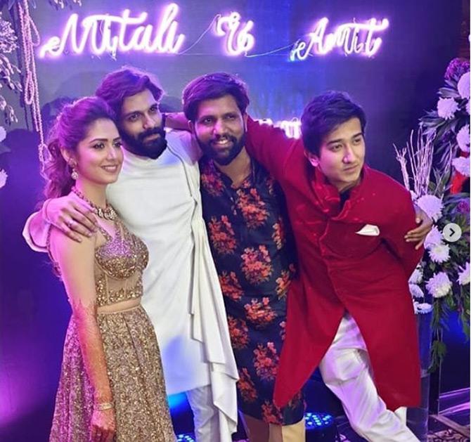 Amit Thackeray and Mitali Borude pose with their close friends at their wedding reception. Pic/Instagram Mahesh Ove