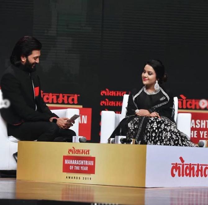 Amruta Fadnavis took to Instagram to share inside photos from the event held in Mumbai.
In picture: Amruta Fadnavis in a tongue in cheek conversation with actor Riteish Deshmukh.
