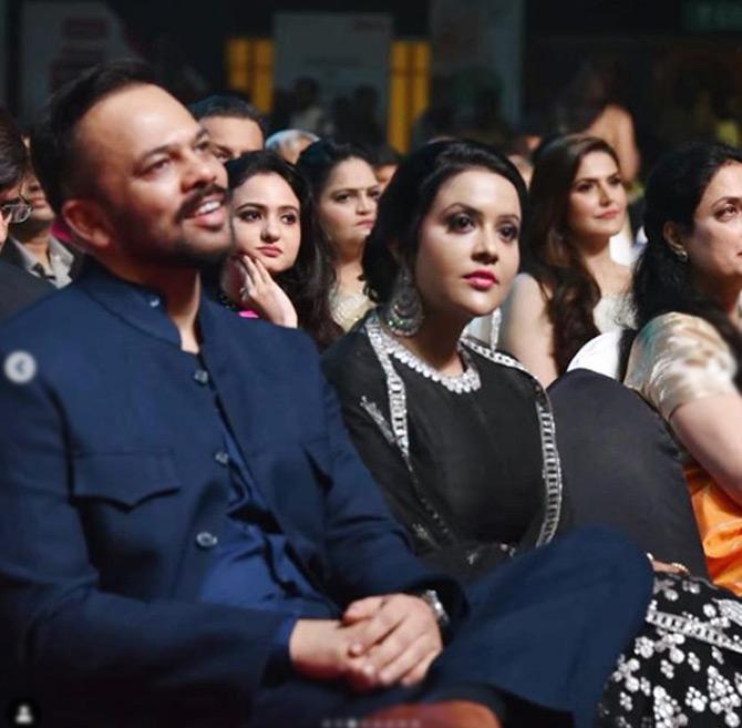 In picture: Rohit Shetty seems to be having a great time at the Maharashtrian of the year awards ceremony while Amruta Fadnavis looks on.
