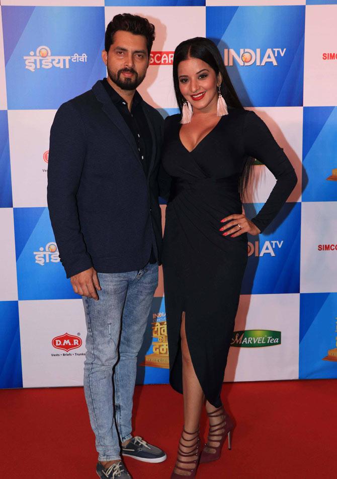 Antara Biswas, aka Mona Lisa, posed with husband Vikrant Singh Rajpoot at the conclave. Mona Lisa chose a simple yet stunning black dress that she paired with shoulder-grazing earrings and gladiator sandals. Her husband, on the other hand, wore a blue blazer over a black shirt and jeans.