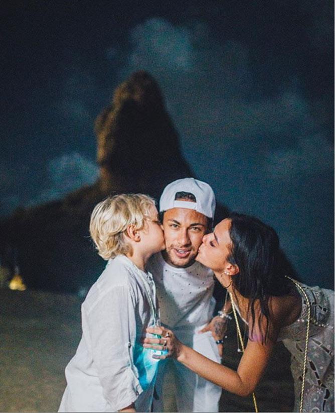 Neymar has won two La Liga titles, 3 Copa del Rey titles, 1 UEFA Champions League title and a FIFA Club World Cup with Barcelona
Neymar posted this picture with his son and his ex-girlfriend Bruna Marquezine while bringing in the New Year in 2016.