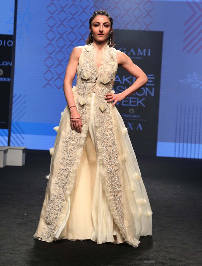 Soha Ali Khan opted for an ivory white dress with silver embellishment to walk the ramp at Lakme Fashion Week Summer/Resort 2019.