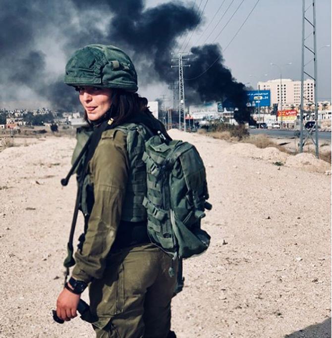 Noam Shoshani is a soldier in Israel Defense Forces (IDF). She proudly captions this picture as, 'Another day at work.' She loves capturing her self in the uniform during her patrols at the borders of southern Israel.
(Pics courtesy: Instagram Noam Shoshani)