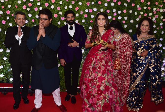 In pic: Raj Thackeray along with the newly married couple Amit Thackeray and Mitali Borude thank the media as they pose for the paparazzi. Also seen in the picture is Dr. Sanjay Borude and Sandhya Borude, parents of Mitali and Raj Thackeray's wife Sharmila Thackeray.