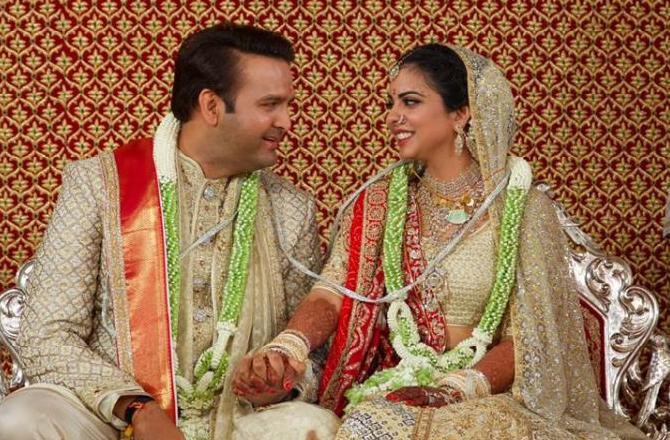 Isha Ambani and Anand Piramal tied the knot on December 12, 2018, in a lavish ceremony held at the Ambanis home in Antilla, Mumbai. The newly-married couple's wedding was attended by who's who of the global business, politics, Bollywood and Hollywood. The guest's list included big names such as former president Pranab Mukherjee, ex-US secretary of state and first- lady Hillary Clinton, the Bachchans, Aamir Khan, Sachin Tendulkar and Priyanka Chopra among others.In picture: Isha Ambani and Anand Piramal tied the knot in the presence of their family and friends.