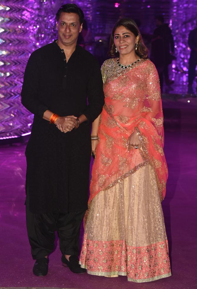 Madhur Bhandarkar was clicked with his wife Renu Namboodiri as the couple posed for the shutterbugs at Azhar Morani's sangeet bash.