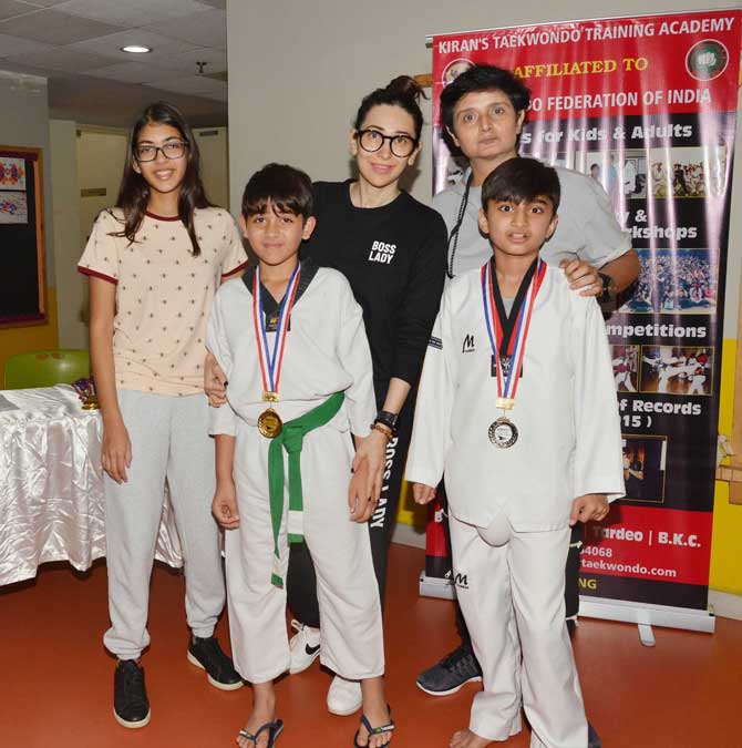 Karisma Kapoor was spotted cheering for his son Kiaan Raj Kapoor at a taekwondo academy in Khar. Her elder daughter Samaira was also present. Kiran's Taekwondo Training Academy (KTTA) was established in 1985. It is frequented by star kids such Shahraan Dutt and Iqra Dutt, Rasha Thadani and more. All pictures/Yogen Shah