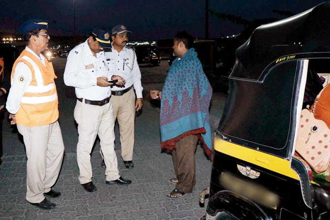Errant drivers tried different tricks to avoid penalty for not wearing the uniform; this man hid under a shawl
