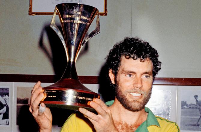 Australian cricket captain Greg Chappell holding the B&H World Series Cup on February 3, 1981, two days after the underarm incident. Pic/Getty Images